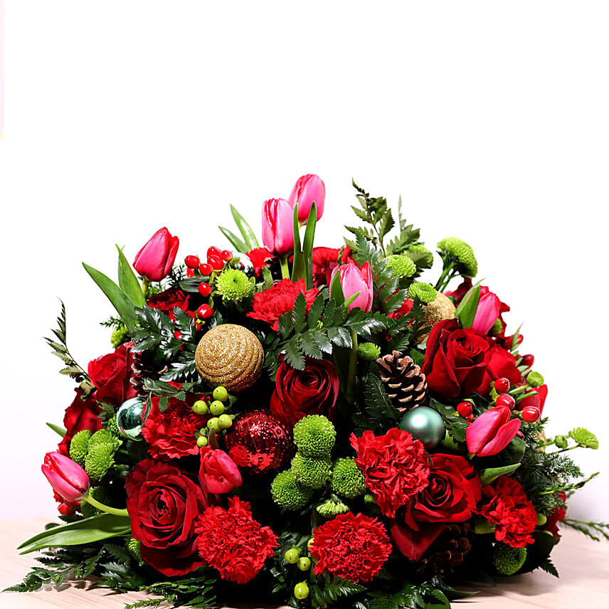 Red And Green Center Table Arrangement: Christmas Flowers