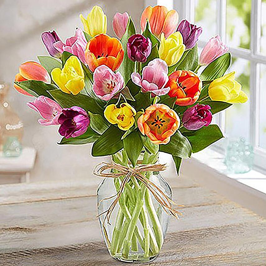 Colourful Tulips In Glass Vase: Housewarming Gifts