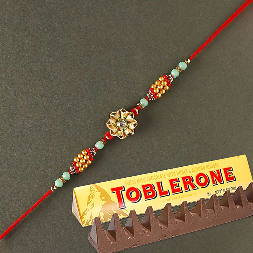 Sneh Trendy Flower Rakhi with Toblerone: Rakhi Gifts For Brother