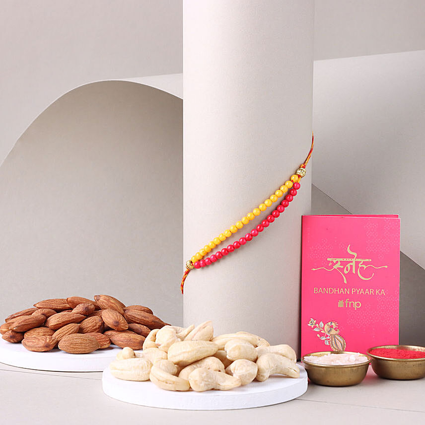 Sneh Red and Yellow Bead Rakhi with Almond: Rakhi With Dryfruits