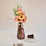 Delightful Gerbera Vase With Sliced Cake