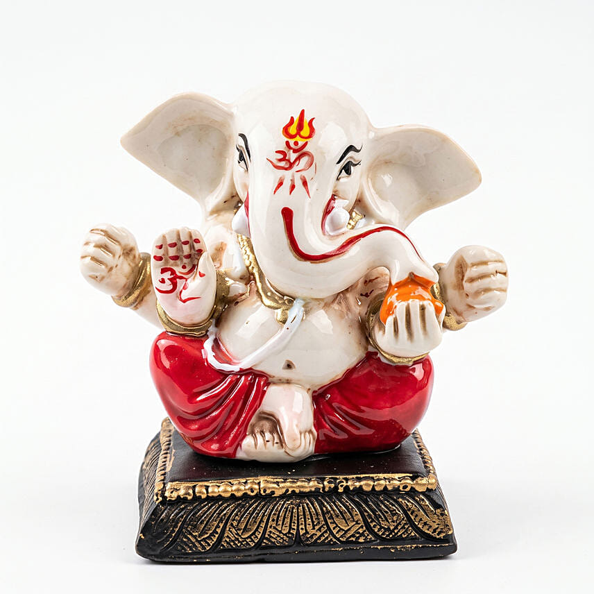 Ganesha Idol with Swastika Rakhi and Gulab Jamun