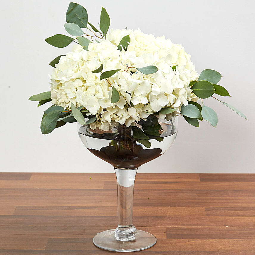 Hydrangeas In Clear Wine Glass Vase