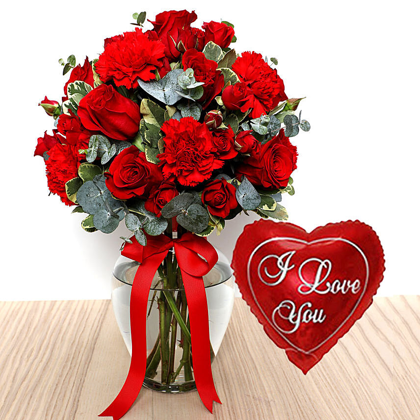 Red Flowers In Glass Vase With I Love You Balloon For Valentines