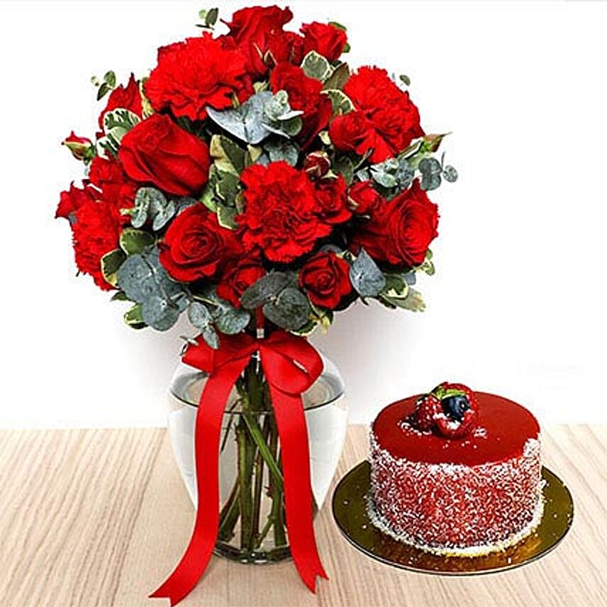 Red Flowers In Glass Vase With Mini Mousse Cake For Valentines