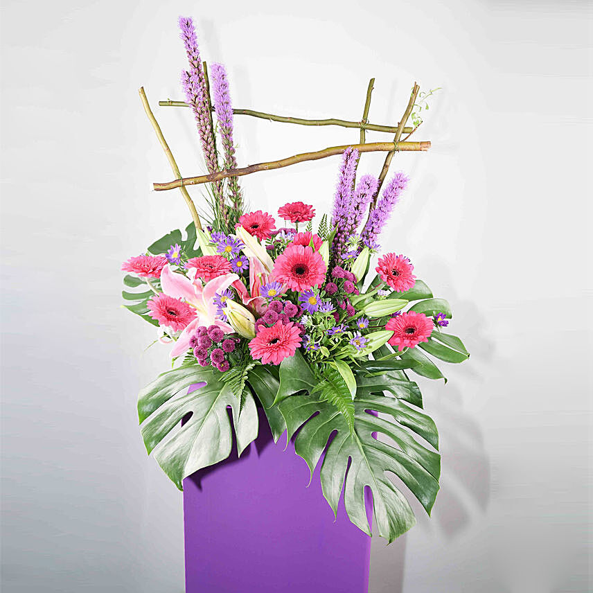 Alluring Mixed Flowers Purple Cardboard Stand