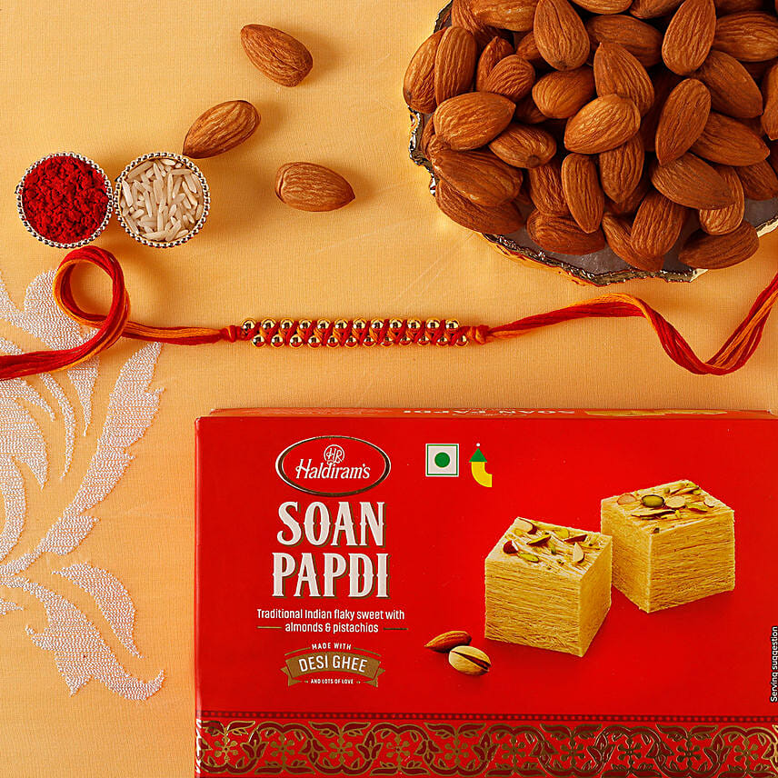 Sneh Elegant Gold Rakhi with Soan Papdi