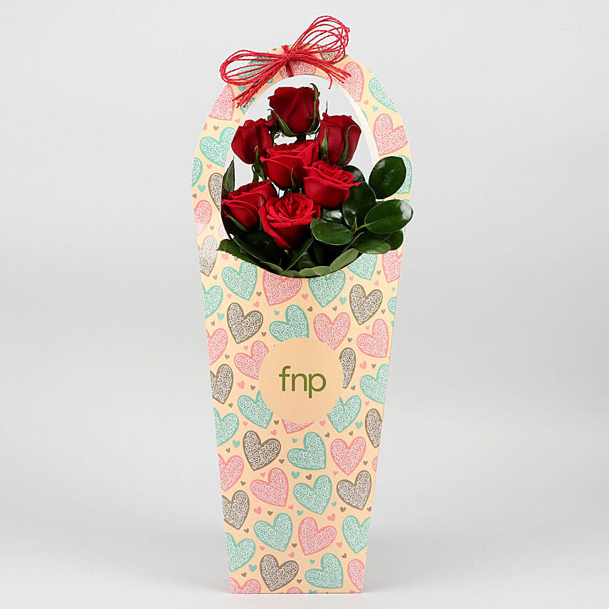 Red Roses In FNP Heart Sleeve Delivery in Singapore - FNP SG