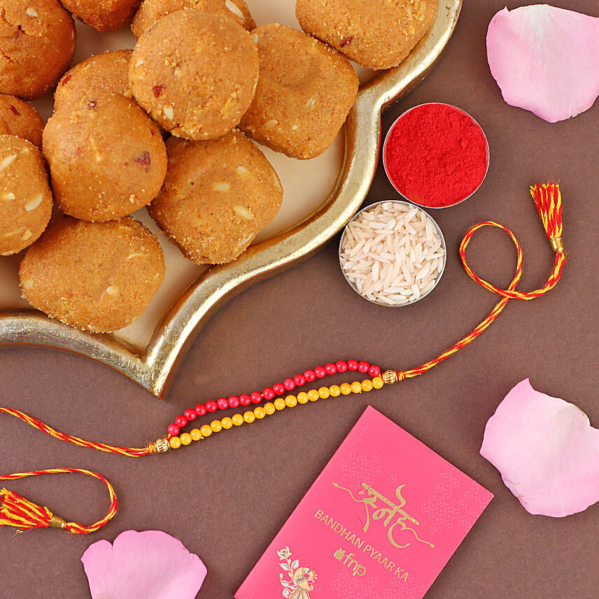 Sneh Red and Yellow Bead Rakhi with Besan laddoo