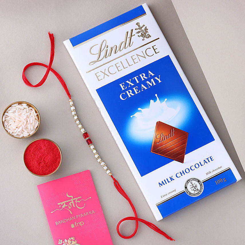 Sneh White and Red Bead Rakhi with Lindt Extra Creamy Milk Chocolate
