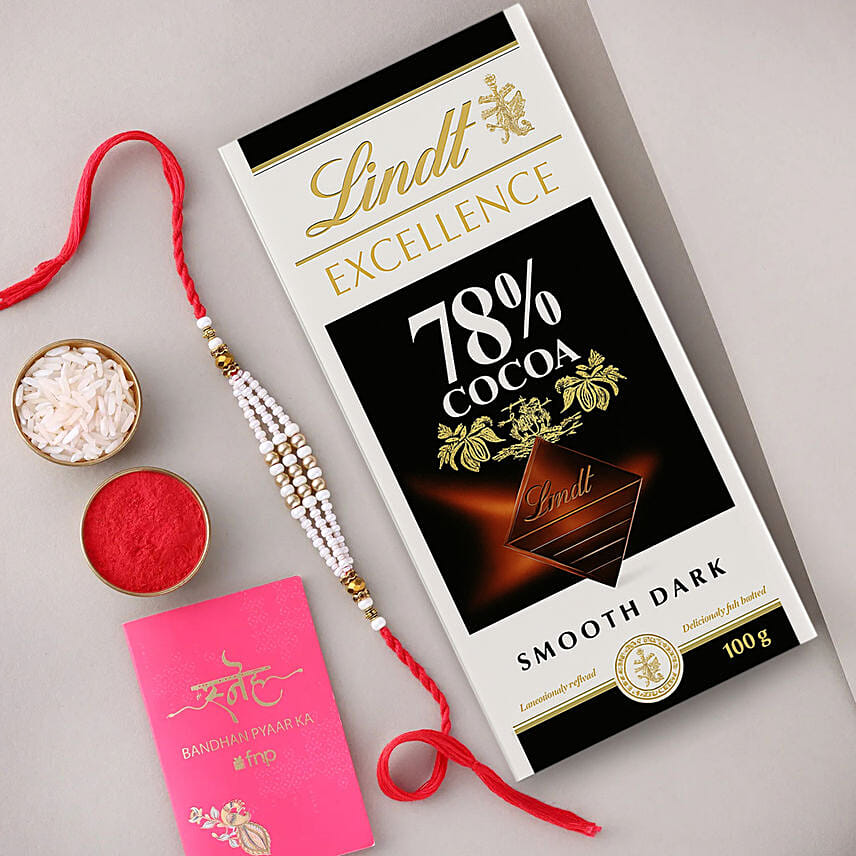 Sneh White Pearl Bead Rakhi with Lindt Extra Creamy Milk Chocolate: Rakhi Combos