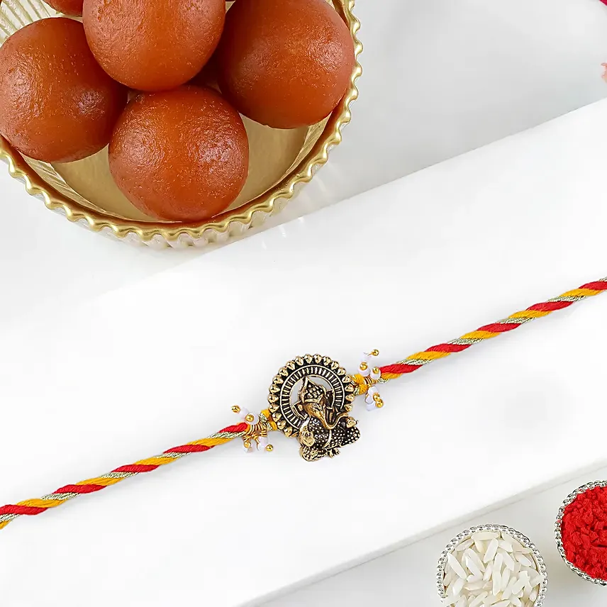 Luxe Ganesha Blessings Rakhi with Gulab Jamun: 