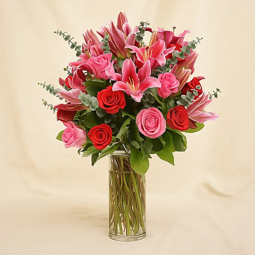 Mixed Roses Stargazer Lilies In Glass Vase Arrangement
