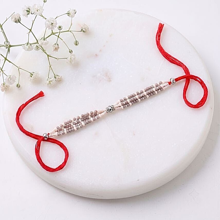 Sneh Exquisite white Pearl Rakhi with Ck Free for Men Perfume