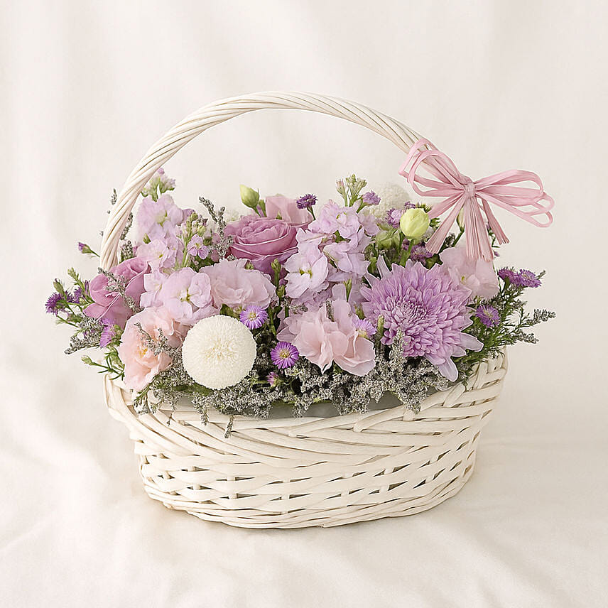 Enticing Mixed Flowers Round Basket: Flower Baskets