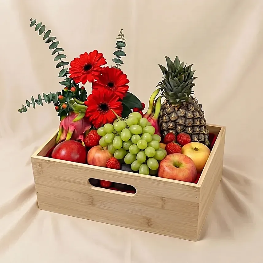 Mixed Red Flowers & Assorted Fruits Oval Basket: Wellness Hampers