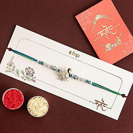 Mystic Harmony Peacock Rakhi: Rakhi 