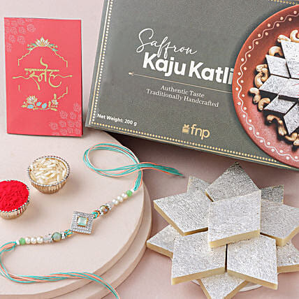 Regal American Diamond Studded Rakhi N Saffron Kaju Katli Delight: Rakhi Gifts For Brother