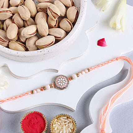 Rosy American Diamond Rakhi N Pistachio Combo: Rakhi With Dryfruits