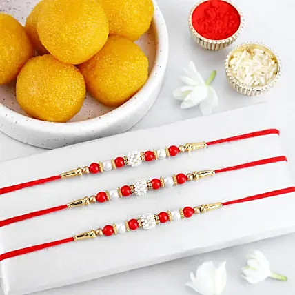 Timeless Pearl Rakhi Set of 3 N Laddoo Combo: Rakhi Sets