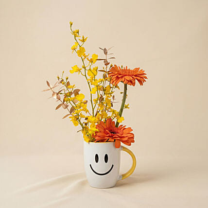 Golden Sunshine Smiley Mug Arrangement: Happy Mother's Day Flowers