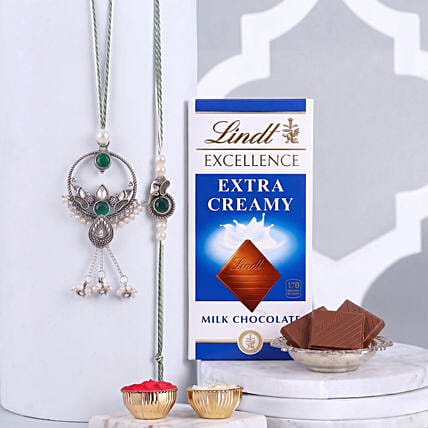 Green Round Bhaiya Bhabhi Rakhi Rakhi with Lindt Chocolate Bar: Lumba Rakhi