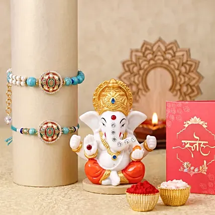 Designer Stone Bhaiya Bhabhi Rakhi and Ganesha Idol Set: 