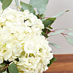 Hydrangeas In Clear Wine Glass Vase