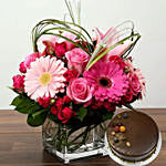 Pink Flowers In Glass Vase With Chocolate Cake