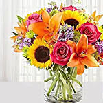 Colored Flowers Vase Arrangement With Wine