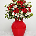 Red Carnations In Red Glass Vase