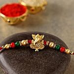 Divine Golden Pearl Thread Rakhis And Gulab Jamun Tin