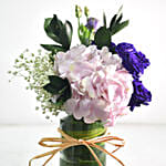 Beautiful Mixed Flowers In Round Glass Vase