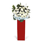 White Chrysanth White Pom Arrangement In Red Stand