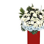 White Chrysanth White Pom Arrangement In Red Stand