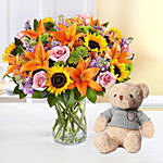Vibrant Bunch of Flowers With Teddy Bear