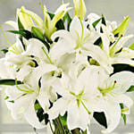 Serene Arranagement Of White Lilies With Birthday Balloons