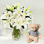 Serene Arranagement Of White Lilies With Teddy Bear