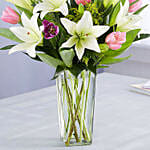 Medley Of Lilies And Tulips In Glass Vase