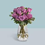 Purple Roses Arrangement In A Glass Vase