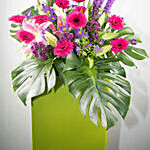 Alluring Mixed Flowers Green Cardboard Stand