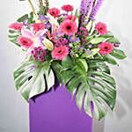 Alluring Mixed Flowers Purple Cardboard Stand