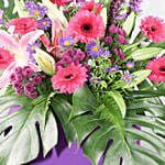 Alluring Mixed Flowers Purple Cardboard Stand