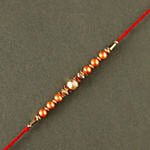 Sneh Rose Gold Pearl And Beads Rakhi With Lindt Premium Chocolates