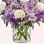 White And Purple Floral Bunch In Glass Vase