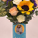 Captivating Sunflower and Roses In Cylindric Personalised Glass Vase