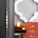 Attractive 6 Stolen Roses Bouquet with Green Pearl Rakhi