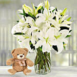 Serene Arranagement Of White Lilies With Teddy Bear