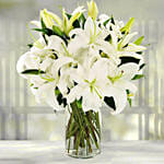 Serene Arranagement Of White Lilies With Teddy Bear