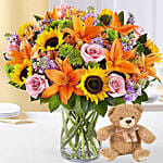 Vibrant Bunch of Flowers With Teddy Bear